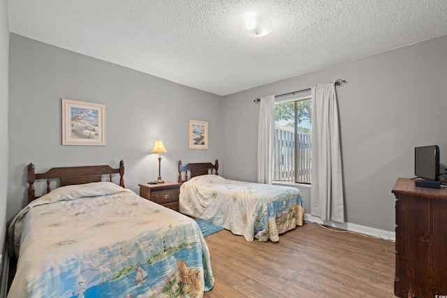 800 9th Ave S Unit N-1, North Myrtle Beach, SC 29582 - bedroom featuring a textured ceiling and wood finished floors