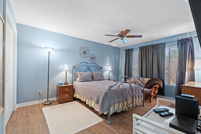 800 9th Ave S Unit N-1, North Myrtle Beach, SC 29582 - bedroom featuring a textured ceiling, wood finished floors, and ceiling fan