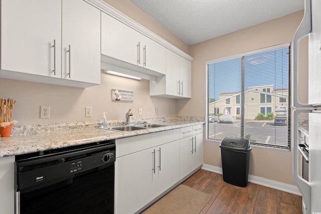 800 9th Ave S Unit N-1, North Myrtle Beach, SC 29582 - kitchen with dishwasher, hardwood / wood-style floors, light countertops, white cabinets, and freestanding refrigerator
