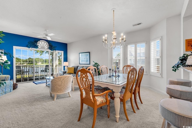 4400 Turtle Ln Unit 2-D, Little River, SC 29566 - dining space with light carpet, a chandelier, and ceiling fan