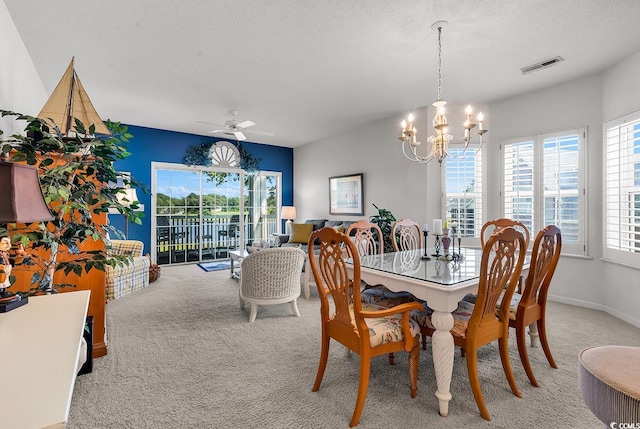 4400 Turtle Ln Unit 2-D, Little River, SC 29566 - carpeted dining room with a chandelier, ceiling fan, and a textured ceiling