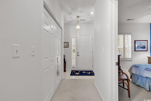 4400 Turtle Ln Unit 2-D, Little River, SC 29566 - carpeted foyer with tile patterned floors and baseboards