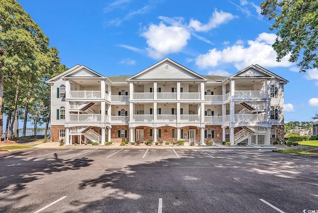 4400 Turtle Ln Unit 2-D, Little River, SC 29566 - view of property with uncovered parking and stairs