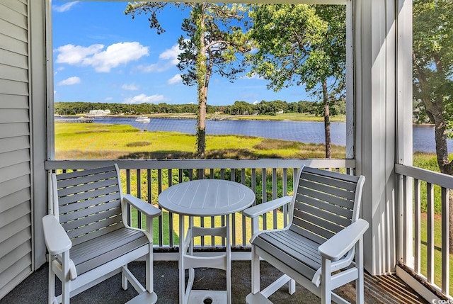 4400 Turtle Ln Unit 2-D, Little River, SC 29566 - wooden terrace featuring a water view