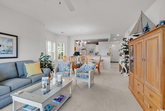 4400 Turtle Ln Unit 2-D, Little River, SC 29566 - living area featuring light carpet, a chandelier, and a ceiling fan