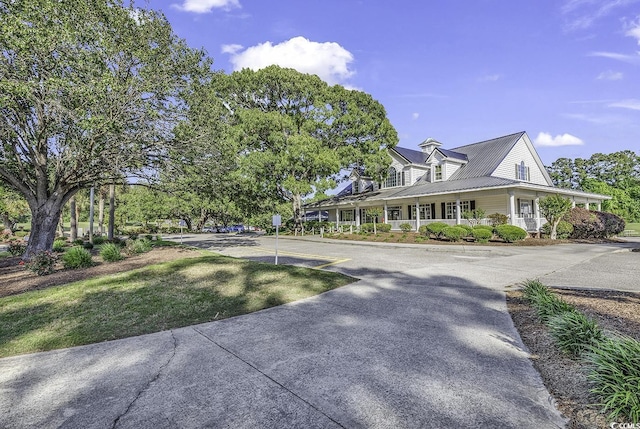 4400 Turtle Ln Unit 2-D, Little River, SC 29566 - view of front of home featuring a metal roof and covered porch