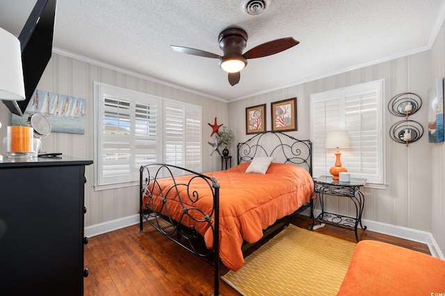 302 46th Ave N, North Myrtle Beach, SC 29582 - bedroom featuring crown molding, hardwood / wood-style flooring, a textured ceiling, and a ceiling fan
