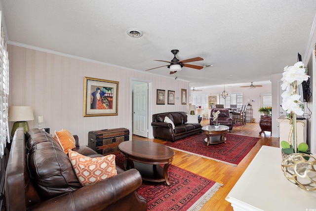 302 46th Ave N, North Myrtle Beach, SC 29582 - living area featuring a ceiling fan, crown molding, a textured ceiling, and wood finished floors