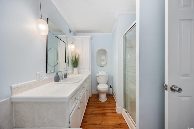 302 46th Ave N, North Myrtle Beach, SC 29582 - bathroom with crown molding, vanity, wood finished floors, and a shower stall