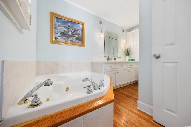 302 46th Ave N, North Myrtle Beach, SC 29582 - full bathroom with ornamental molding, vanity, wood finished floors, and a tub with jets