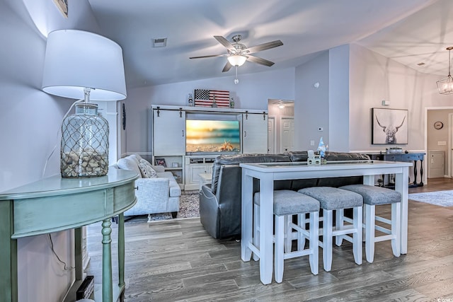 2479 Burning Tree Ln, Little River, SC 29566 - living area with lofted ceiling, wood finished floors, and a ceiling fan