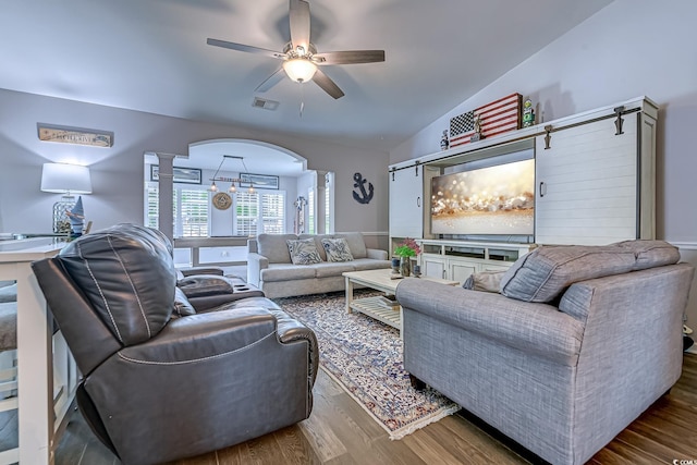 2479 Burning Tree Ln, Little River, SC 29566 - living room with decorative columns, arched walkways, a ceiling fan, wood finished floors, and vaulted ceiling