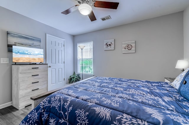 2479 Burning Tree Ln, Little River, SC 29566 - bedroom with dark wood-style floors and ceiling fan