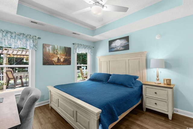 1644 Langley Dr, Longs, SC 29568 - bedroom featuring ornamental molding, dark wood finished floors, a raised ceiling, and a ceiling fan