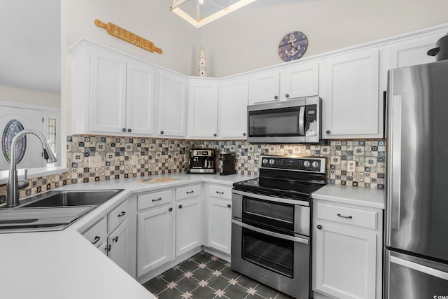 1644 Langley Dr, Longs, SC 29568 - kitchen featuring stainless steel appliances, dark flooring, light countertops, decorative backsplash, and white cabinetry