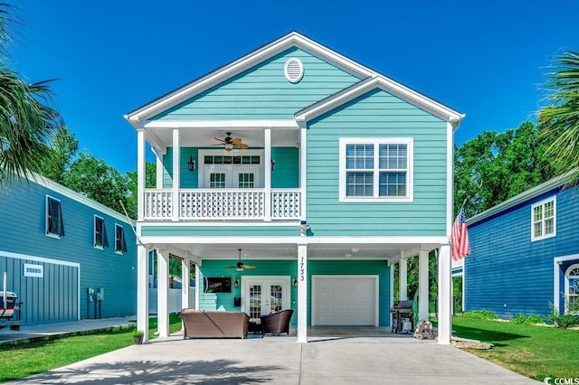 1733 24th Ave N, North Myrtle Beach, SC 29582 - view of front of property with a carport, ceiling fan, french doors, and driveway