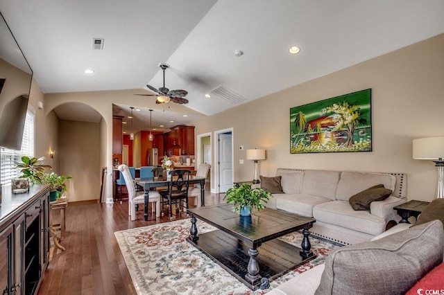 1733 24th Ave N, North Myrtle Beach, SC 29582 - living room with a ceiling fan, arched walkways, vaulted ceiling, and dark wood-style floors