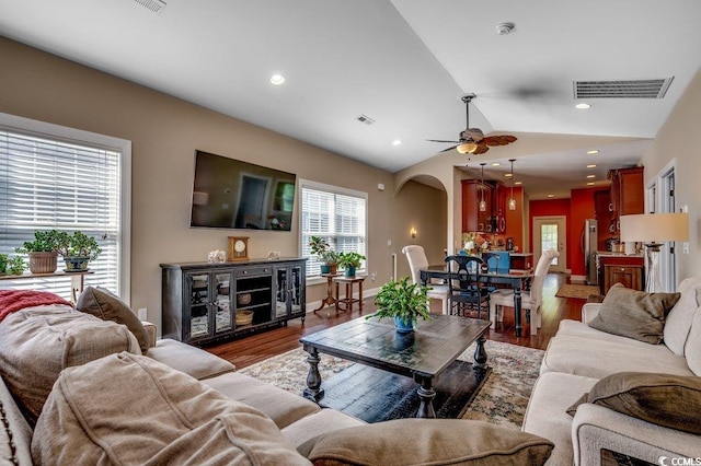1733 24th Ave N, North Myrtle Beach, SC 29582 - living area with arched walkways, wood finished floors, vaulted ceiling, ceiling fan, and recessed lighting