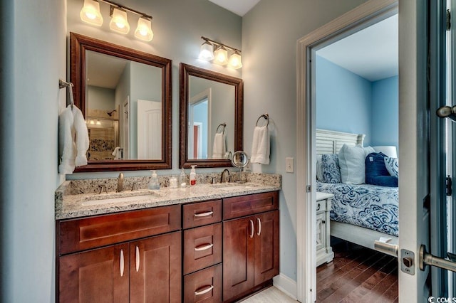 1733 24th Ave N, North Myrtle Beach, SC 29582 - bathroom with double vanity, wood finished floors, tiled shower, and ensuite bath