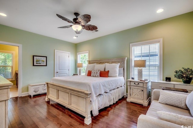 1733 24th Ave N, North Myrtle Beach, SC 29582 - bedroom featuring multiple windows, dark wood-type flooring, recessed lighting, ceiling fan, and ensuite bathroom