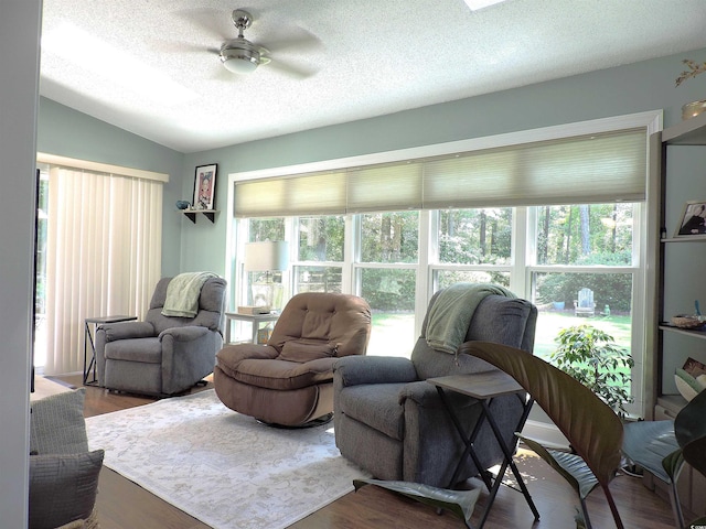 1307 Carolina Wren Ln, Murrells Inlet, SC 29576 - living area featuring a textured ceiling, lofted ceiling, a ceiling fan, and wood finished floors