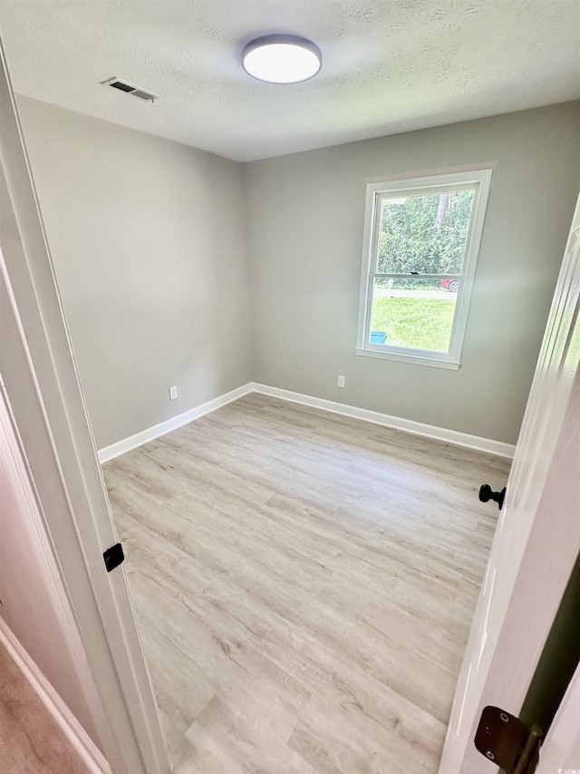 616 Mckinley Way, Conway, SC 29526 - empty room with light wood-style flooring and a textured ceiling