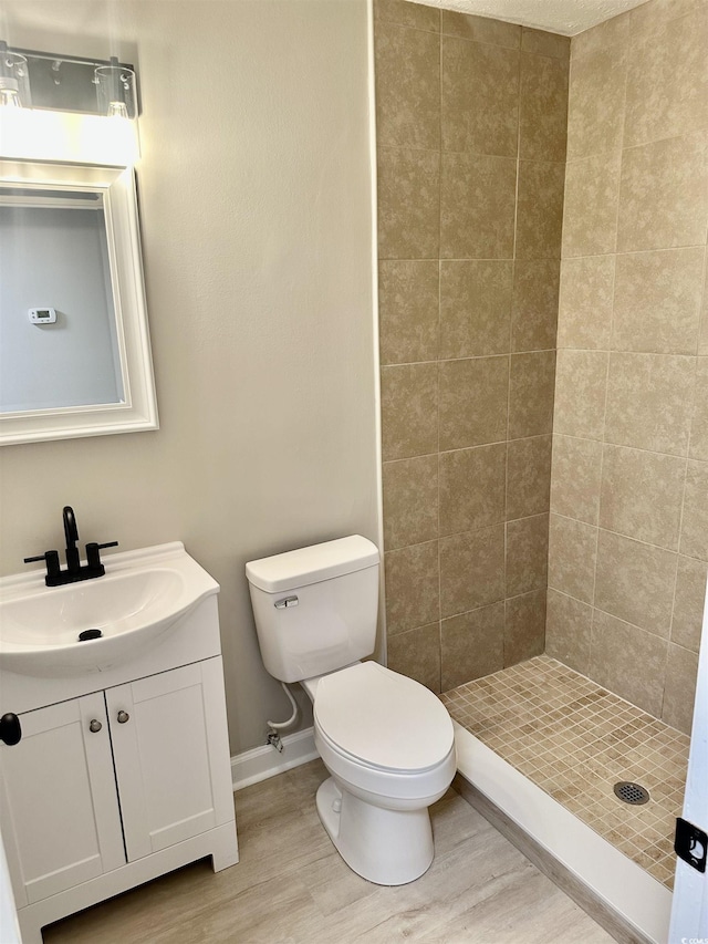 616 Mckinley Way, Conway, SC 29526 - bathroom featuring wood finished floors, vanity, and a tile shower