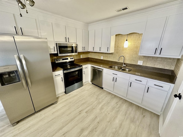 616 Mckinley Way, Conway, SC 29526 - kitchen featuring appliances with stainless steel finishes, dark countertops, and white cabinetry