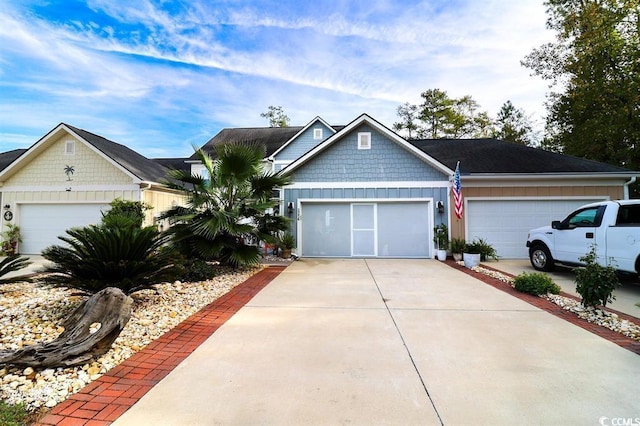 2256 Heritage Loop Unit 2256, Myrtle Beach, SC 29577 - view of front facade with board and batten siding, concrete driveway, and a garage