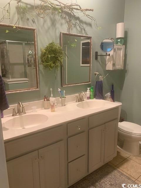 2256 Heritage Loop Unit 2256, Myrtle Beach, SC 29577 - bathroom featuring double vanity, a shower with shower door, and tile patterned floors