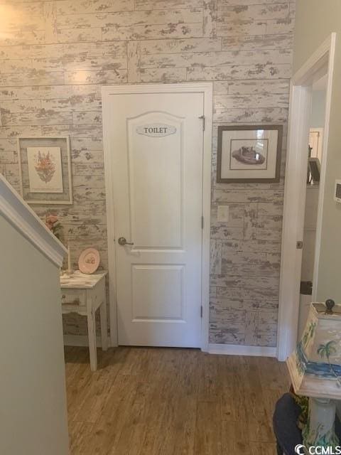 2256 Heritage Loop Unit 2256, Myrtle Beach, SC 29577 - hall featuring wallpapered walls and wood finished floors