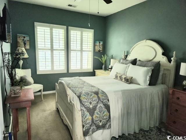 2256 Heritage Loop Unit 2256, Myrtle Beach, SC 29577 - carpeted bedroom featuring baseboards and a ceiling fan