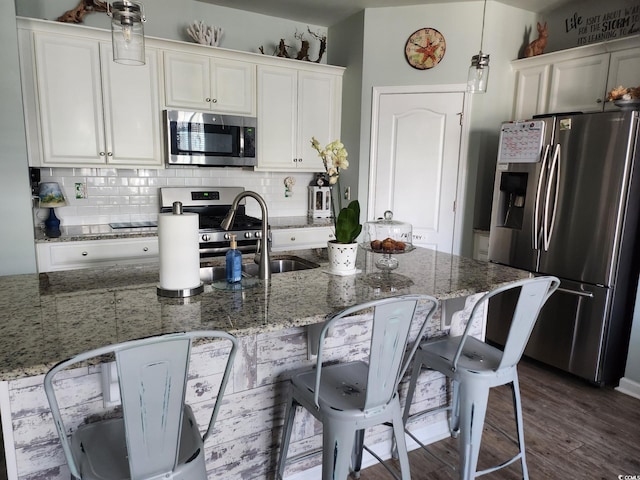 2256 Heritage Loop Unit 2256, Myrtle Beach, SC 29577 - kitchen with appliances with stainless steel finishes, decorative backsplash, and white cabinetry