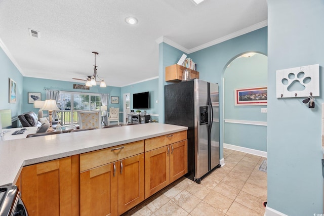 4683 Wild Iris Dr Unit 103, Myrtle Beach, SC 29577 - kitchen featuring stainless steel fridge with ice dispenser, crown molding, open floor plan, arched walkways, and light countertops