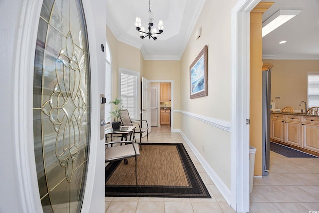 139 Avian Dr Unit 6-201, Pawleys Island, SC 29585 - entrance foyer with light tile patterned floors, a chandelier, and ornamental molding