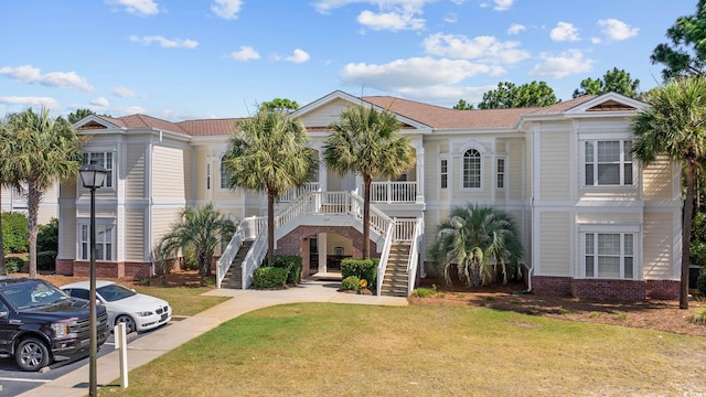 139 Avian Dr Unit 6-201, Pawleys Island, SC 29585 - view of property with stairs and uncovered parking