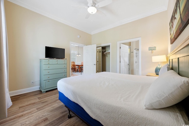 139 Avian Dr Unit 6-201, Pawleys Island, SC 29585 - bedroom featuring crown molding, light wood-type flooring, a closet, a ceiling fan, and ensuite bathroom