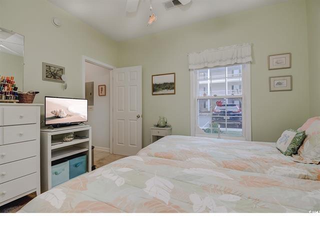 1058 Sea Mountain Hwy Unit 10-101, North Myrtle Beach, SC 29582 - bedroom featuring a ceiling fan