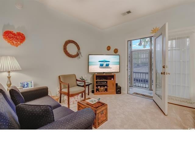 1058 Sea Mountain Hwy Unit 10-101, North Myrtle Beach, SC 29582 - carpeted living room with french doors