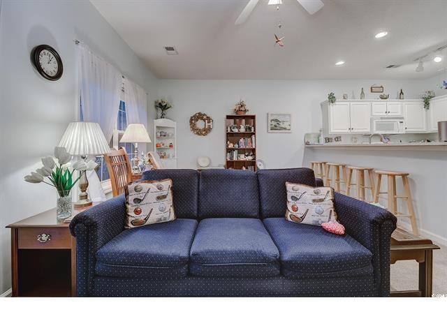 1058 Sea Mountain Hwy Unit 10-101, North Myrtle Beach, SC 29582 - carpeted living room with ceiling fan and recessed lighting