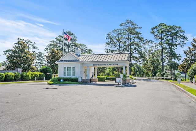 LOT142 Millbank Rd, Georgetown, SC 29440 - view of asphalt road with curbs, sidewalks, and a gated entry