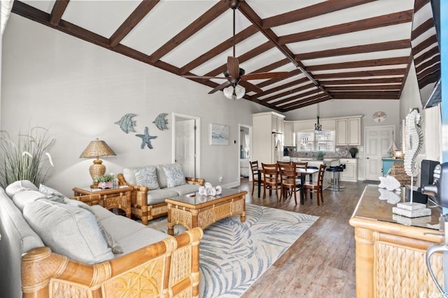 325 N 58th Ave N, North Myrtle Beach, SC 29582 - living room featuring beam ceiling, a ceiling fan, plenty of natural light, dark wood-type flooring, and high vaulted ceiling