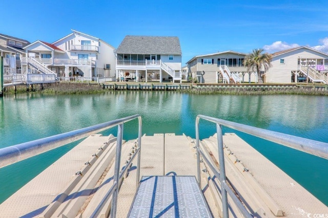 325 N 58th Ave N, North Myrtle Beach, SC 29582 - dock featuring a water view and a residential view
