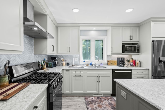 528 George Washington Trl, Georgetown, SC 29440 - kitchen with stainless steel appliances, wall chimney exhaust hood, decorative backsplash, white cabinets, and recessed lighting