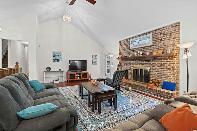 528 George Washington Trl, Georgetown, SC 29440 - living room featuring stairway, wood finished floors, a ceiling fan, high vaulted ceiling, and a brick fireplace