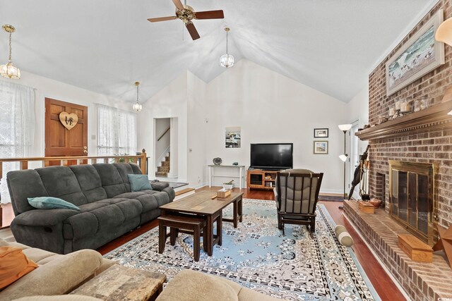 528 George Washington Trl, Georgetown, SC 29440 - living area featuring wood finished floors, ceiling fan, stairs, a brick fireplace, and high vaulted ceiling