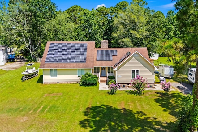528 George Washington Trl, Georgetown, SC 29440 - rear view of house featuring a porch, crawl space, roof mounted solar panels, a yard, and a chimney