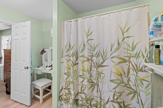 528 George Washington Trl, Georgetown, SC 29440 - full bath with wood finished floors, a textured ceiling, vanity, and curtained shower