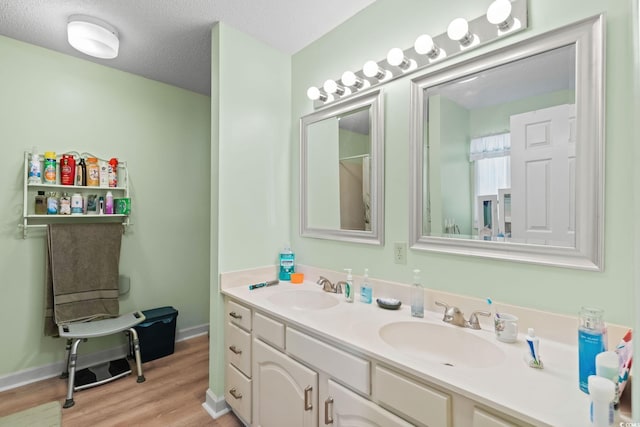 528 George Washington Trl, Georgetown, SC 29440 - full bathroom featuring double vanity and wood finished floors