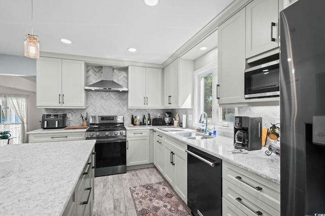 528 George Washington Trl, Georgetown, SC 29440 - kitchen featuring appliances with stainless steel finishes, wall chimney exhaust hood, tasteful backsplash, white cabinets, and recessed lighting